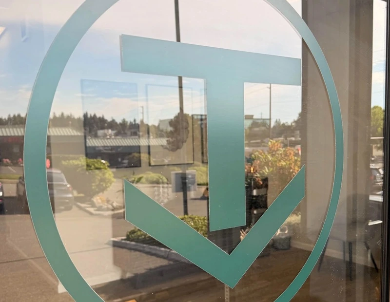 True Chiropractic Bellevue logo displayed on the clinic's glass entrance door